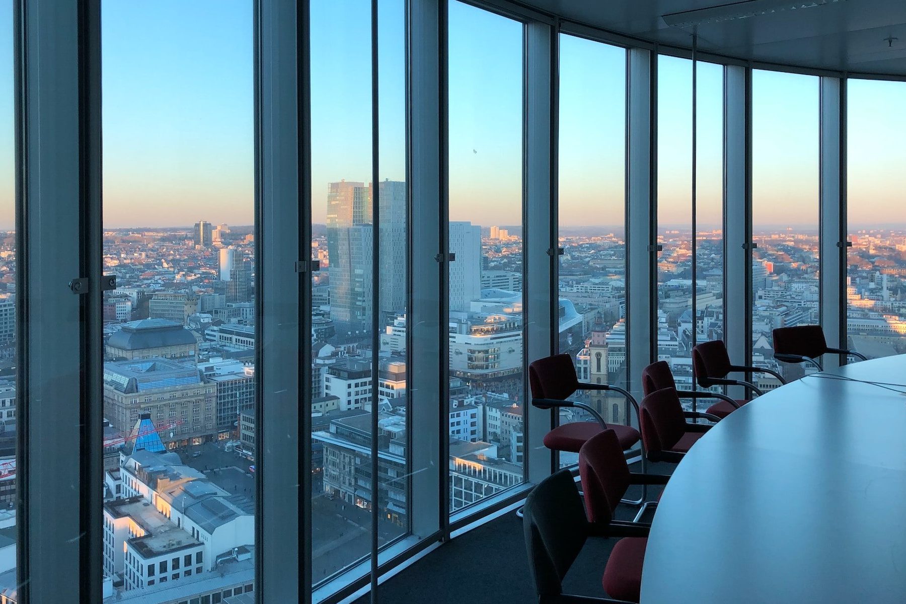 people sitting on chair near glass window during daytime